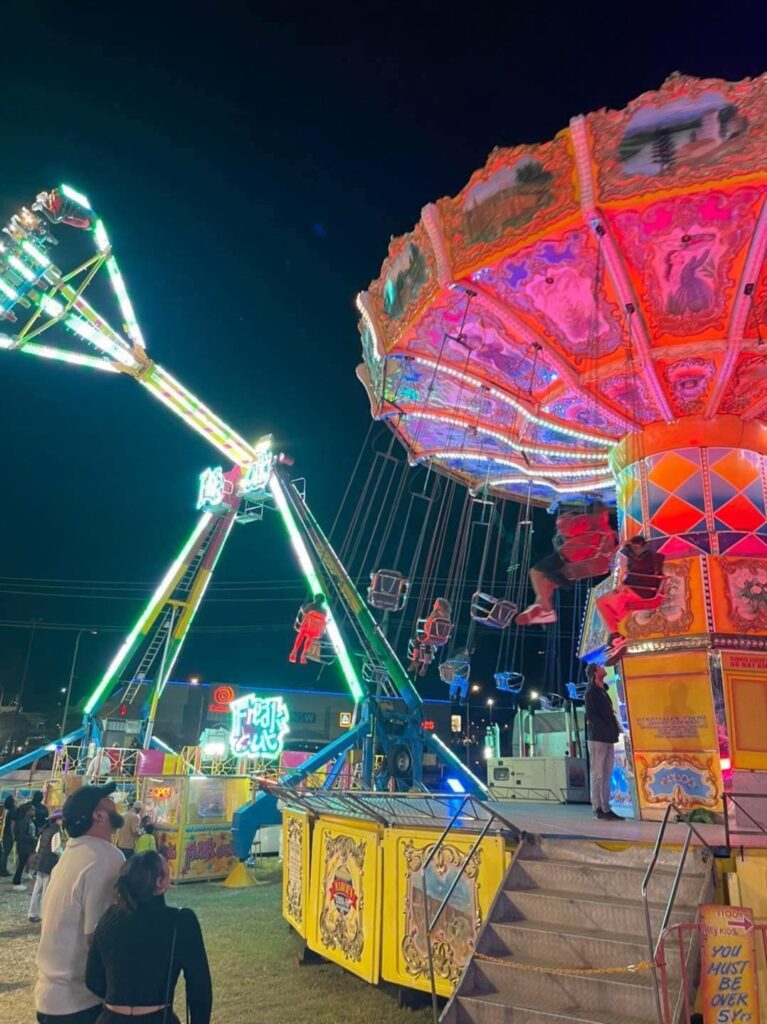 Colourful Redbank Fun Fair rides at night